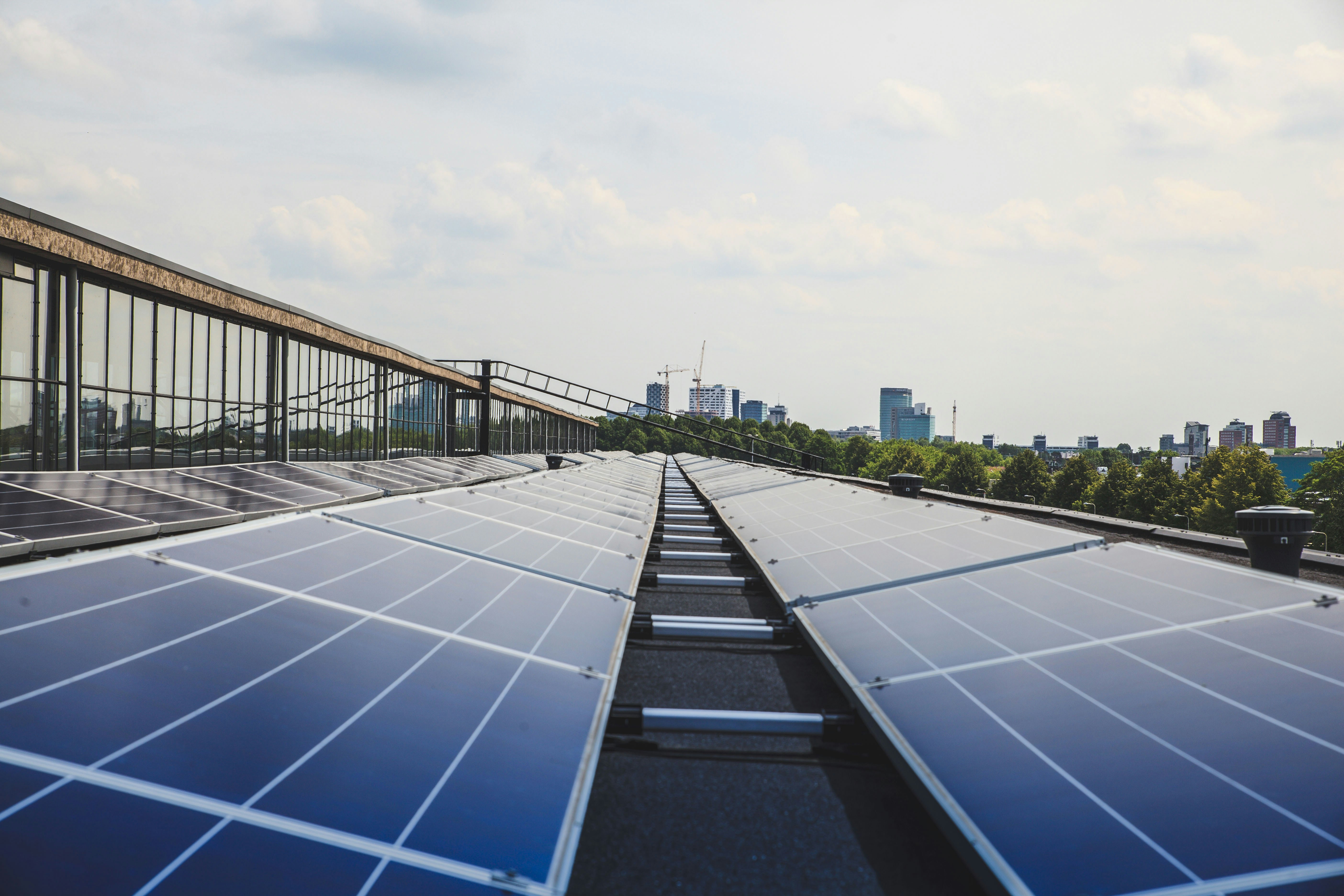Rows of solar panels on a commercial rooftop installation
